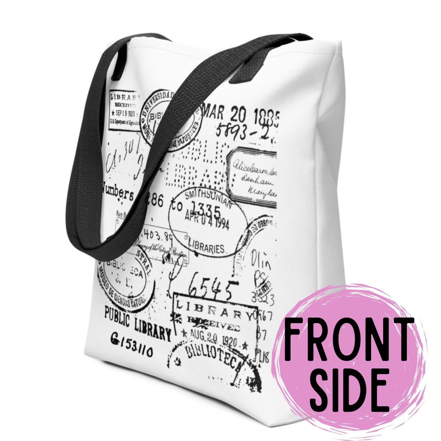a white tote bag with a black handle